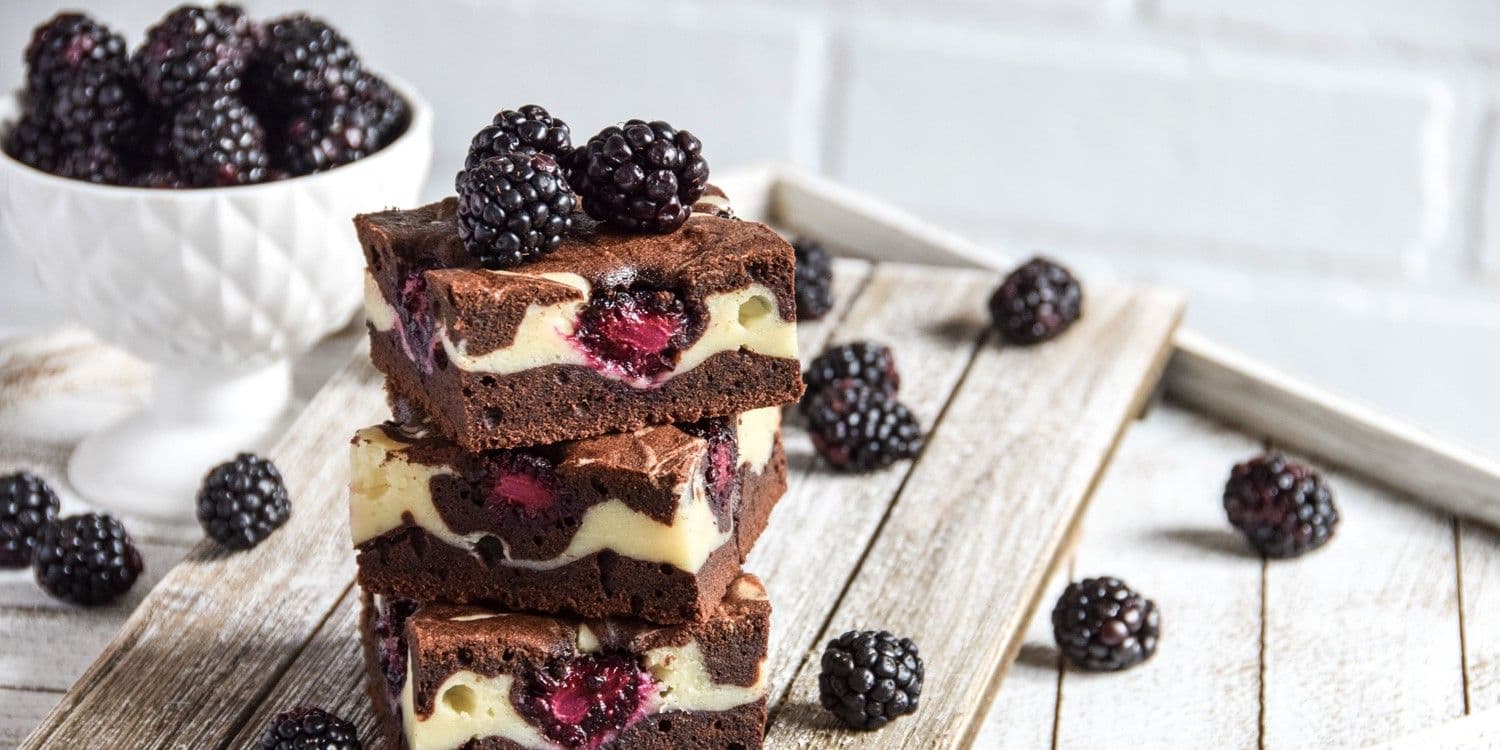 Cheesecake brownies with blackberries