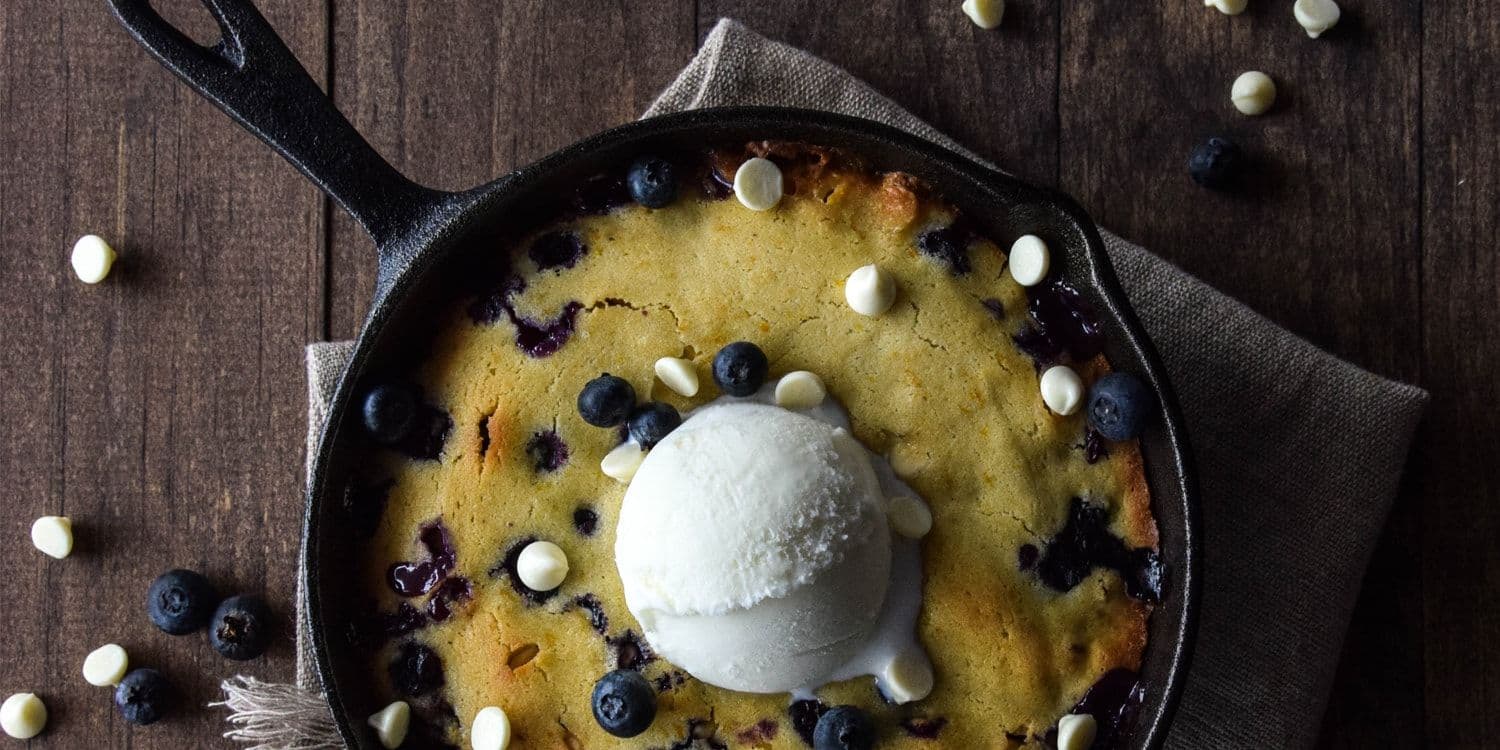 Skillet orange blondie with white chocolate and blueberries